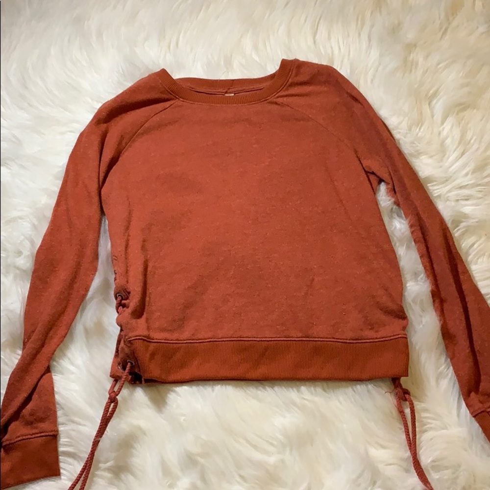 orange lace up crew neck.